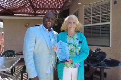 Residents celebrating an achievement outdoors
