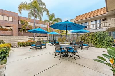Outdoor patio area with seating and umbrellas