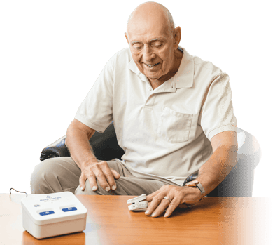 Senior man using medical equipment in a cozy setting