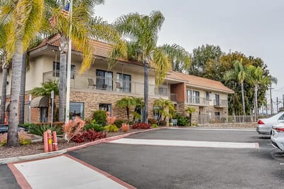 Front exterior view of a nursing home with landscaping
