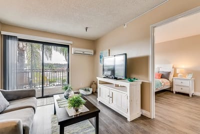 Bright living room with access to balcony and views