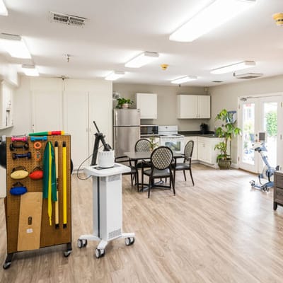 Interior view of a common area with tables and equipment