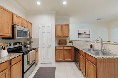 Modern kitchen with wooden cabinets and stainless appliances