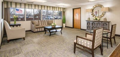Bright common area with seating and natural light