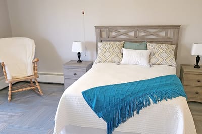 A cozy resident room with a welcome sign