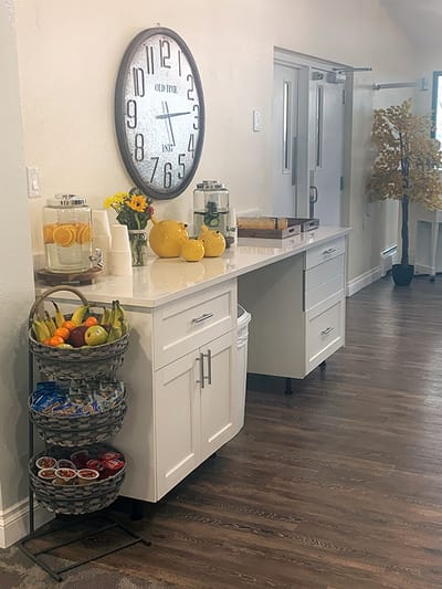 Bright interior with a fruit display and beverages