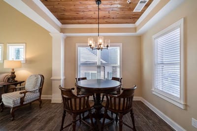 Bright interior setting with a dining table and chairs