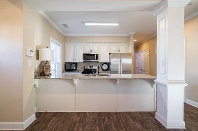 Modern kitchen area with granite countertops