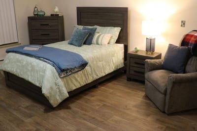 Cozy private resident room with bed and chair