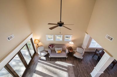 Bright common area with seating and large windows