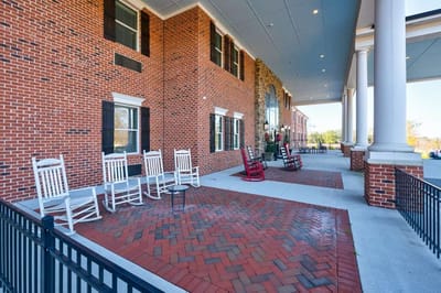 Outdoor seating area with rocking chairs on a patio