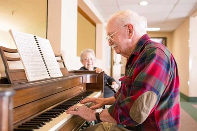 Residents enjoying music in an activity room