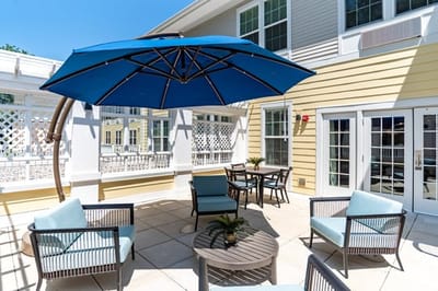 Outdoor patio area with seating and umbrellas