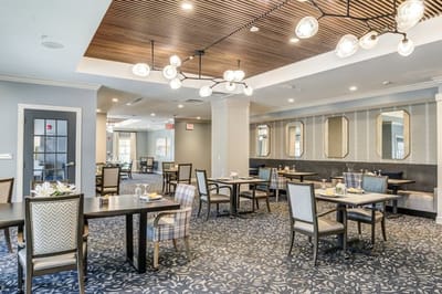 Dining room with elegant decor and tables set for a meal