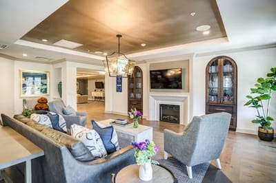 A cozy common area with comfortable seating and decor