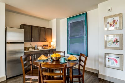 A warm and inviting dining area with a table set for meals