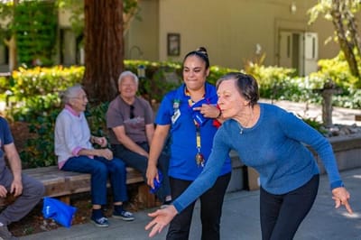 Residents enjoying an outdoor activity at the facility