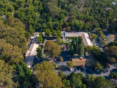Aerial view of Silverado Belmont Hills facility surrounded by greenery