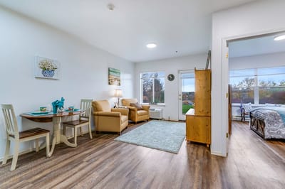 Bright interior of a resident room with sitting area