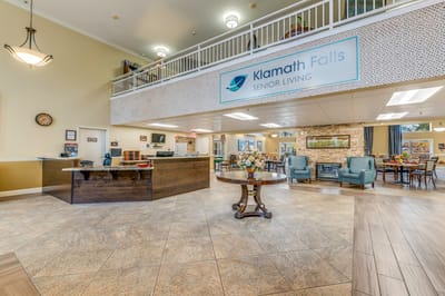 Bright common area with seating and reception desk