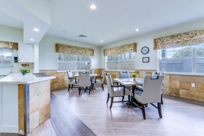 Bright common area with tables and chairs
