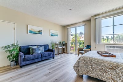 A cozy resident room with ample natural light