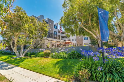Exterior view of Burlingame Senior Living with gardens
