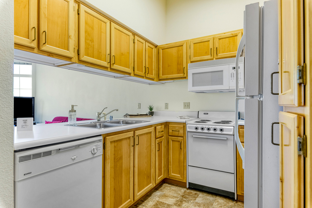 A well-equipped kitchen in a resident's unit