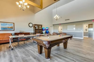 Interior common area with a billiards table and seating
