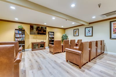 Cozy common area with seating and bookshelves