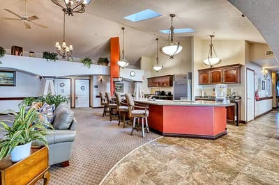 Interior view of a common area with seating and kitchen