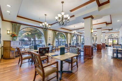 Bright common area with tables and chairs