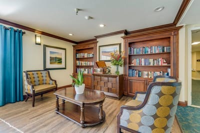 Cozy common area with bookshelves and seating