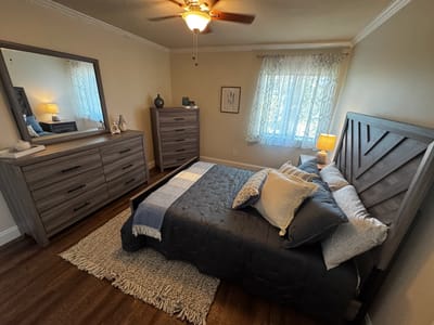 Cozy resident room with a bed and dresser