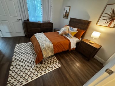 Cozy private room with warm decor and natural light