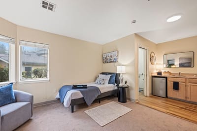 Cozy resident room with seating and kitchenette
