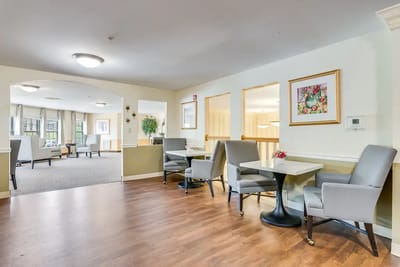 Cozy dining area with tables and chairs
