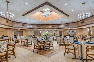 Bright dining room with wood accents and modern chandeliers