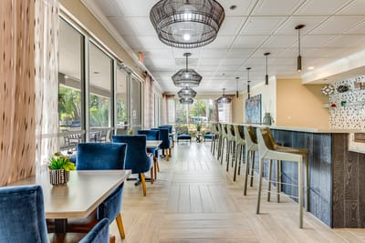 Bright common area with seating and bar