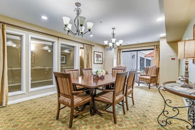 Bright dining room with a large table and chairs