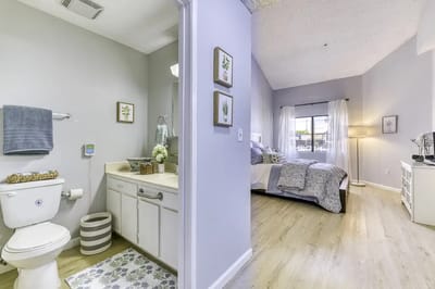 A cozy resident room with a bathroom area