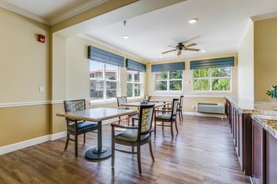 Bright common area with tables and chairs