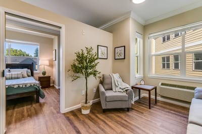 Interior view of a cozy resident room with seating