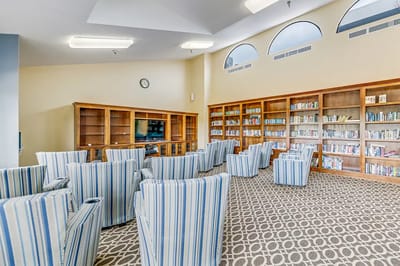Common area with seating and bookshelves