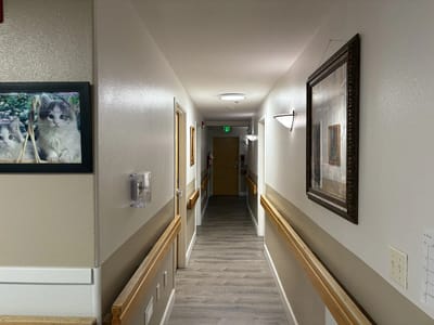 A hallway with artwork on the walls.