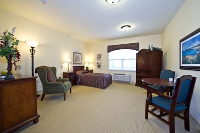 Cozy resident room with furniture and decor