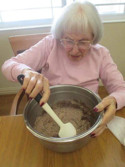 Resident baking in a communal kitchen