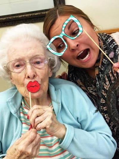 Residents having fun with props in a cheerful setting