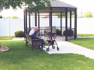 Residents enjoying time in an outdoor gazebo