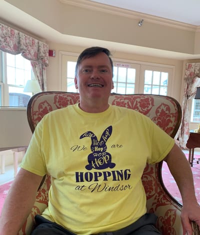 Resident participating in a fun activity at Windsor Medical Center